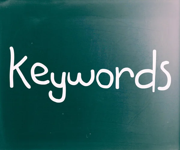 The word "Keywords" handwritten with white chalk on a blackboard — Stock Photo, Image