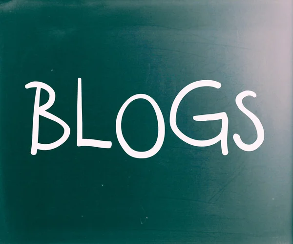"Blogs" handwritten with white chalk on a blackboard — Stock Photo, Image