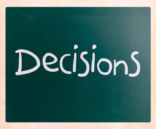 The word "Decisions" handwritten with white chalk on a blackboar — Stock Photo, Image