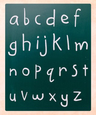 Complete english alphabet handwritten with white chalk on a blac clipart