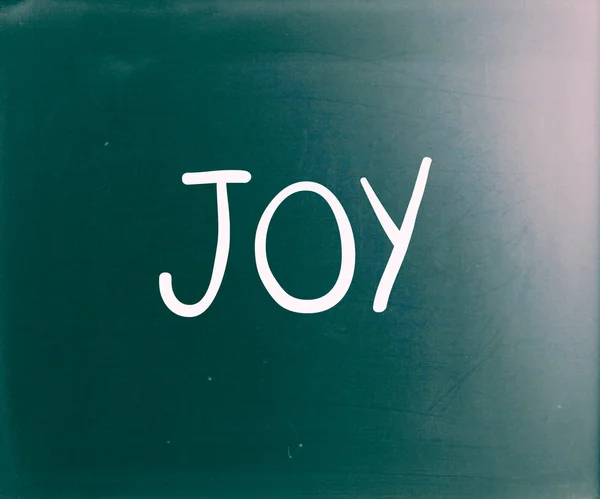 The word "Joy" handwritten with white chalk on a blackboard — Stock Photo, Image