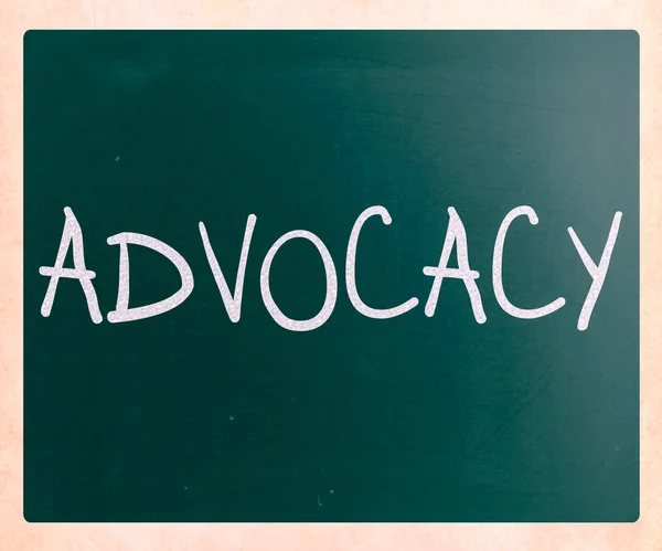 The word 'Advocacy' handwritten with white chalk on a blackboard — Stock Photo, Image