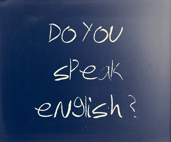 "Do you speak english "handwritten with white chalk on a blackbo — стоковое фото