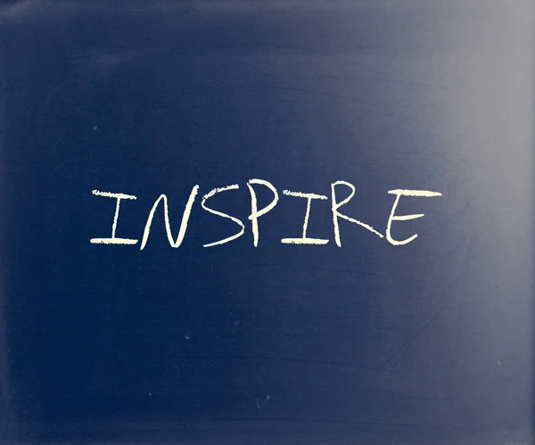 "Inspire" handwritten with white chalk on a blackboard — Stock Photo, Image