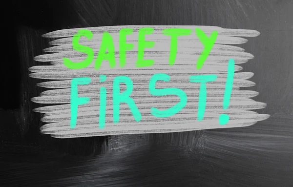 Safety first handwritten with chalk on a blackboard — Stock Photo, Image