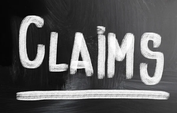 Claims handwritten with chalk on a blackboard — Stock Photo, Image