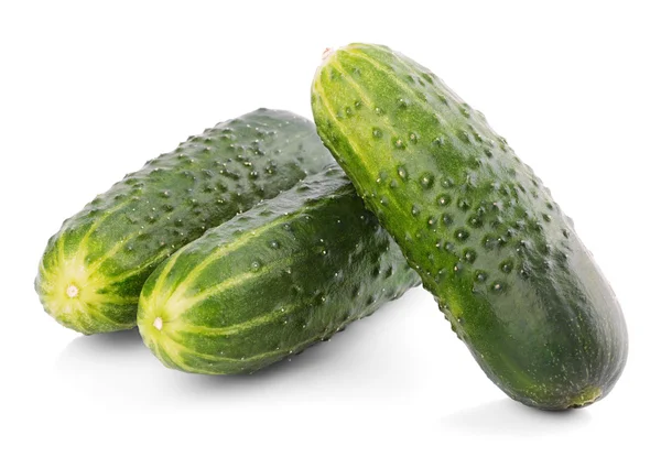 Drie komkommers geïsoleerd op wit — Stockfoto
