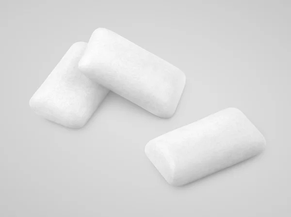 White chewing gums on gray — Stock Photo, Image