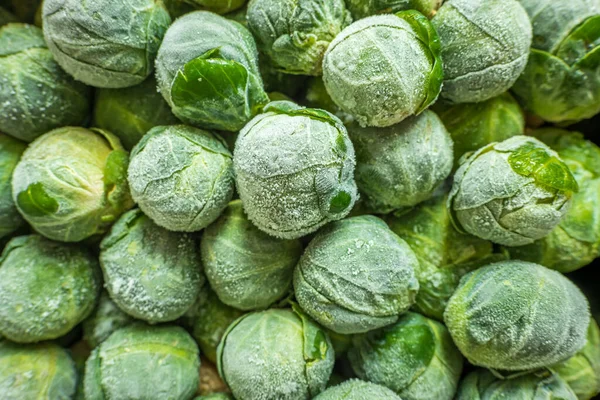Frozen brussels sprouts background closeup — Stock Photo, Image