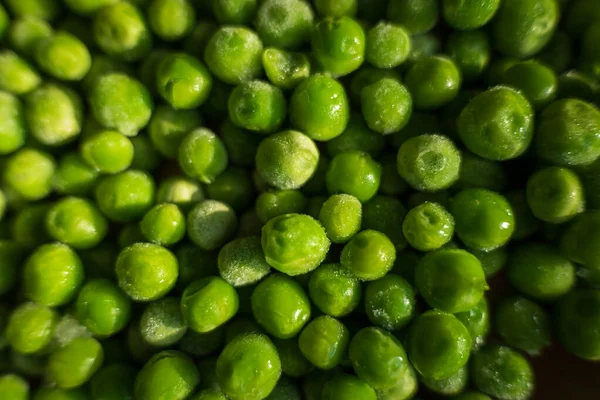 凍てつく緑のエンドウ豆の背景の密接な — ストック写真