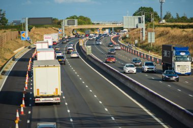 heavy traffic in blurry motion on UK motorway in England. clipart