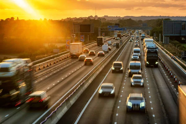 heavy traffic in blurry motion on UK motorway in England.