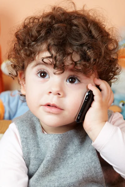 Baby girl talking on phone — Stock Photo, Image