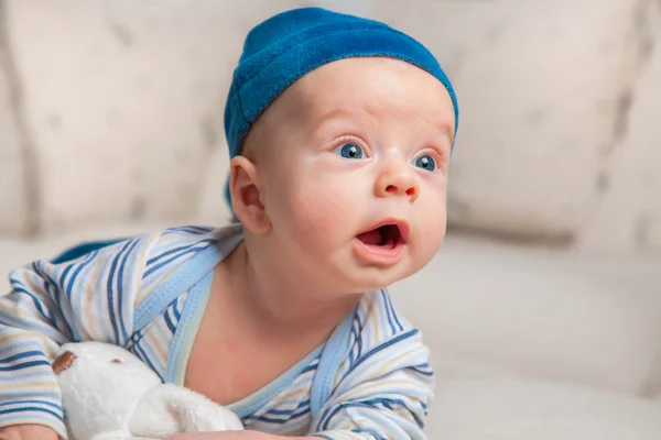 Baby boy trying to roll over — Stock Photo, Image