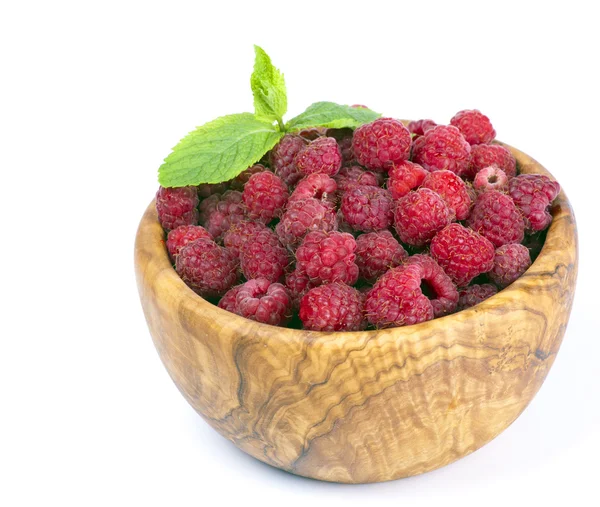 Raspberries in a wooden bowl — Stock Photo, Image