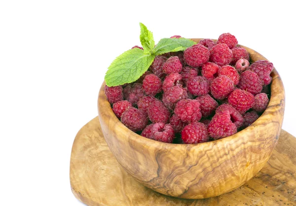 Raspberries in a wooden bowl — Stock Photo, Image