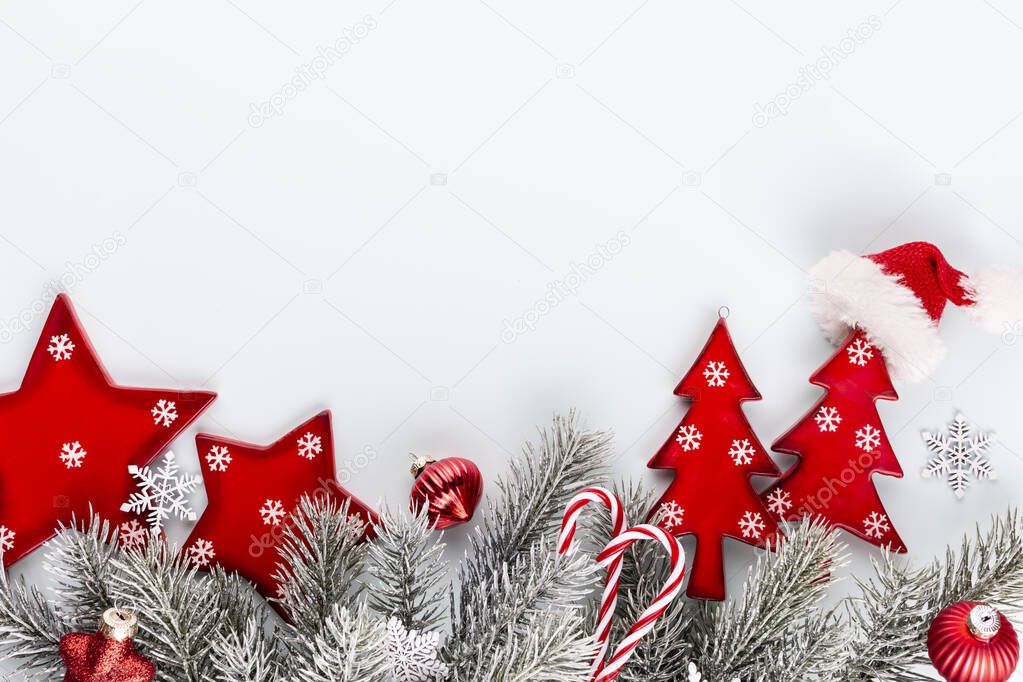 Christmas star and santa hat, decor on pastel blue background.