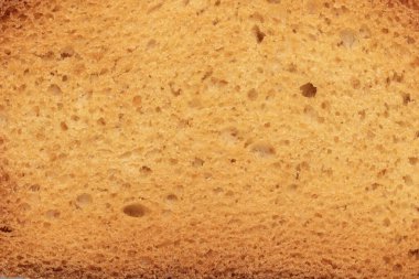 Ekmek arkaplanının yakın plan çekimi. Makro ekmek dilimi deseni.