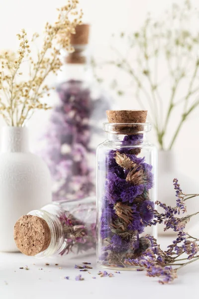 Dried homeopathy flowers with bottle. Natural herbs medicine. Herbal medicine. Homeopathy end alternative medicine backgrouns.