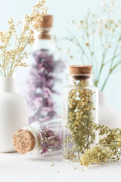 Dried homeopathy flowers with bottle. Natural herbs medicine. Herbal medicine. Homeopathy end alternative medicine backgrouns.