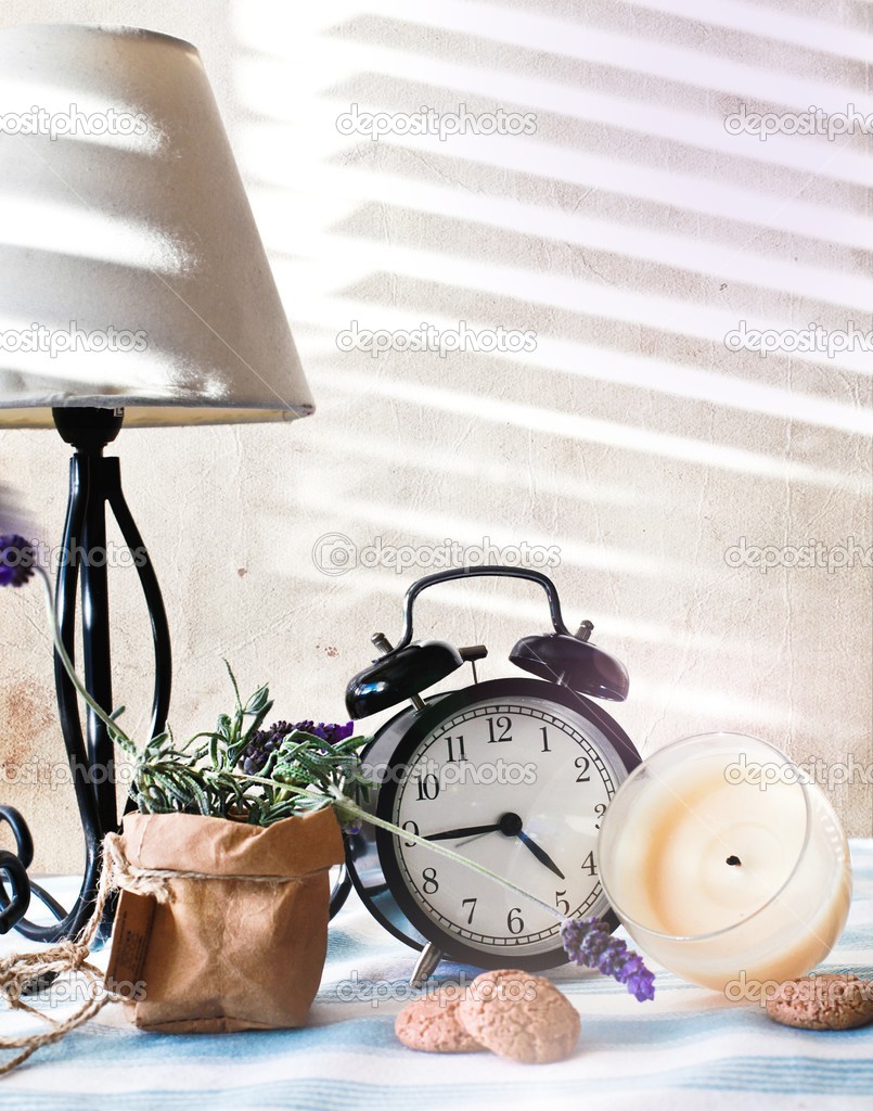 Still life composition with clock
