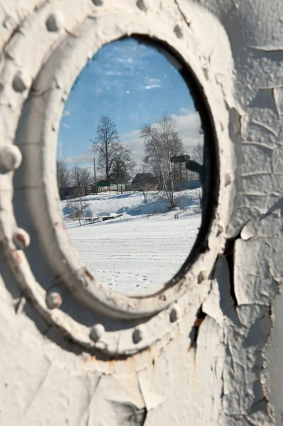 Frozen porthole on the white ships wall. — Stock Photo, Image