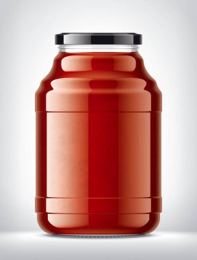 Arka planda domates suyu olan cam kavanoz.. 