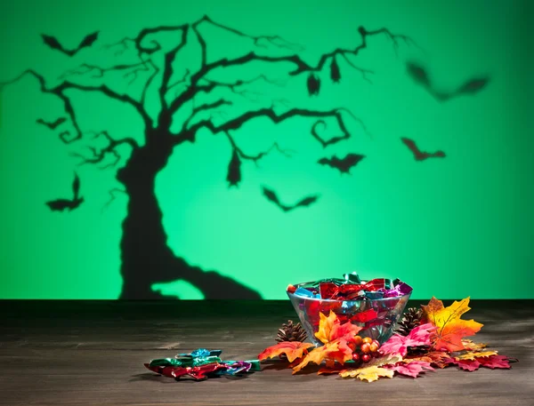 Halloween tree bats and sweets — Stock Photo, Image