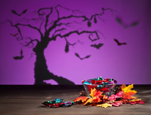 Halloween tree bats and sweets — Stock Photo, Image