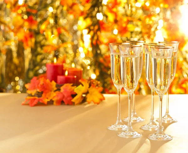 Champagne glasses for reception in front of autumn background — Stock Photo, Image