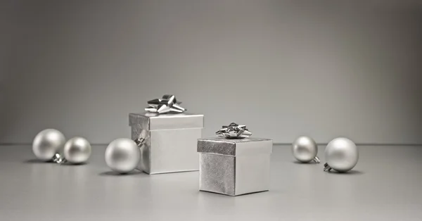 Silver bauble and present — Stock Photo, Image