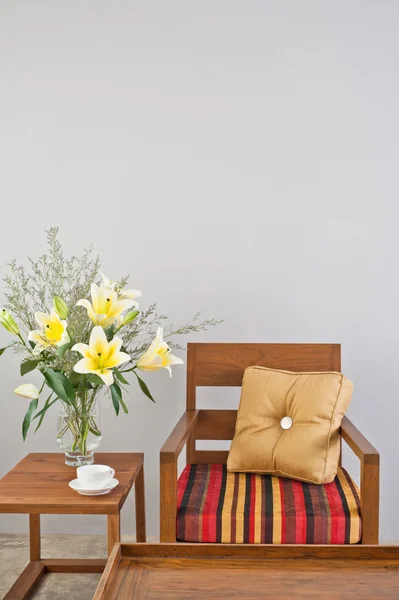 Colorful upholstered chair with side table — Stock Photo, Image