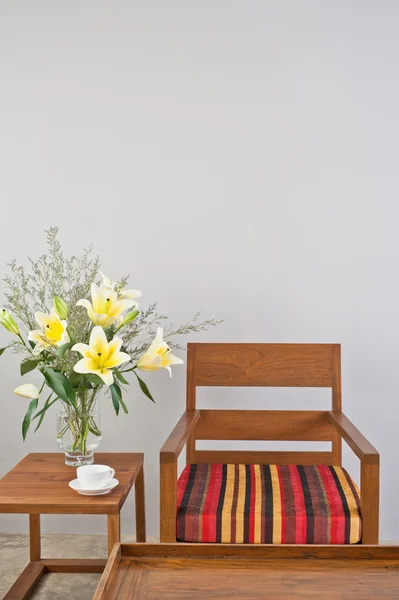 Colorful upholstered chair with side table — Stock Photo, Image