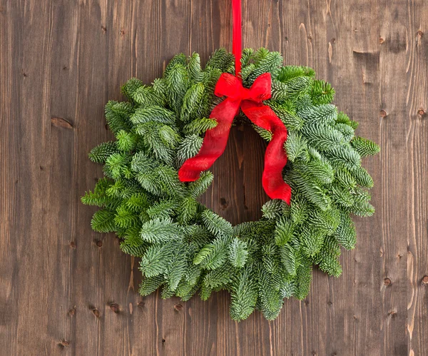 Advent wreath over a brown wooden plank — Stock Photo, Image