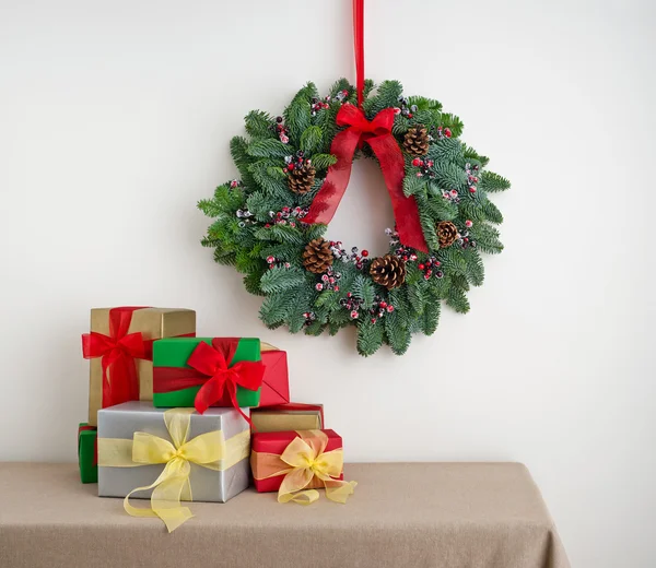 Advent wreath over side board with present — Stock Photo, Image