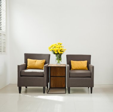 Grey sofa armchair in simple setting clipart