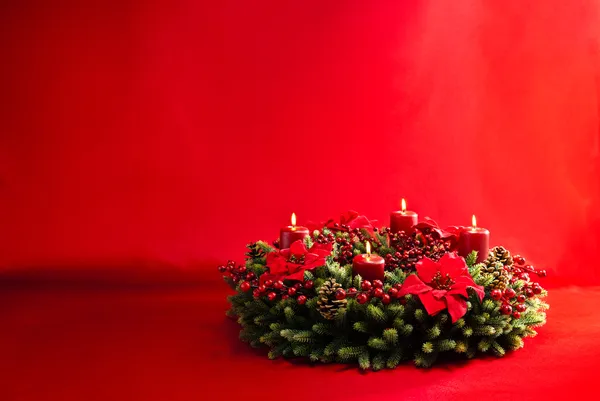 Advent wreath over red background — Stock Photo, Image