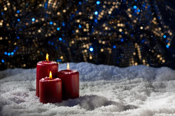 Candles in snow — Stock Photo, Image