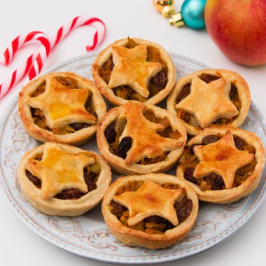 Christmas mince pies on white background.