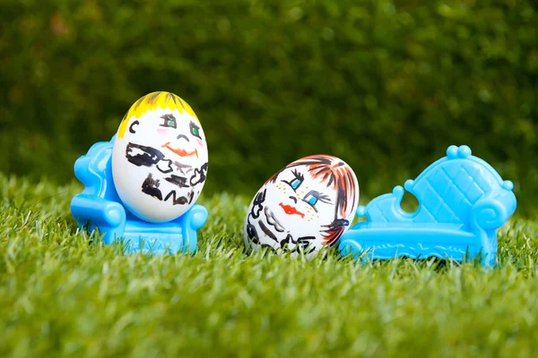 Little egg fellows enjoy on sofa and armchair outdoors — Stock Photo, Image