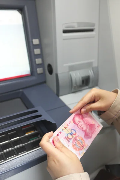 Female hand on ATM — Stock Photo, Image