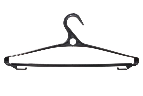 Kunststoff Kleiderbügel schwarz isoliert auf weißem Hintergrund. — Stockfoto
