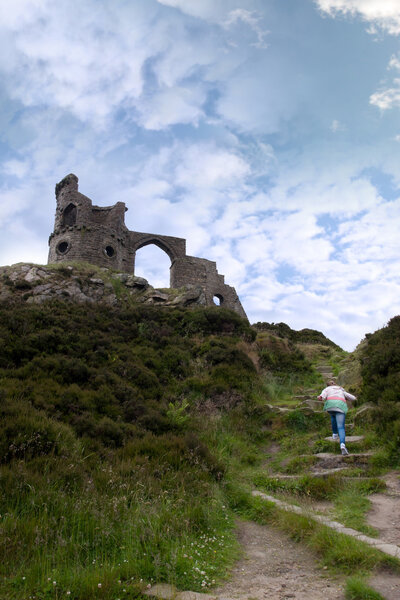 Girl climbing to Mow cop castle