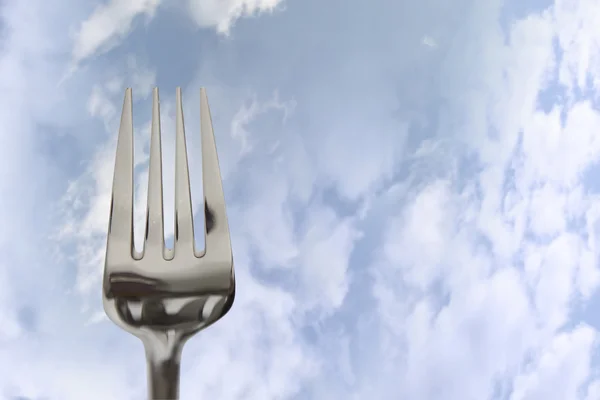 Eating out fork isolated in clouds — Stock Photo, Image