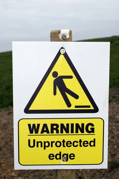 Предупреждающий знак незащищенного края с контуром обрезки — стоковое фото