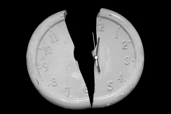 Broken clock face against a black background — Stock Photo, Image