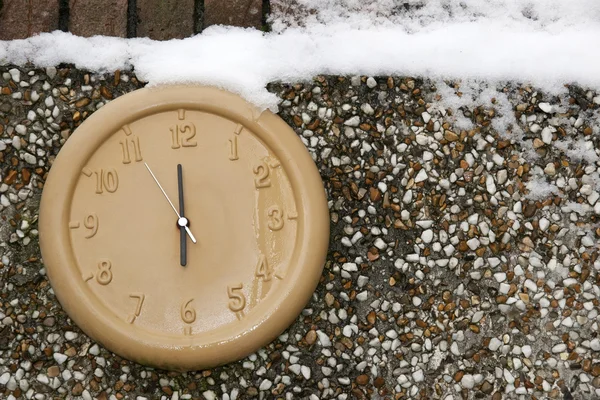 Clock on a wall in the winter season — Stock Photo, Image