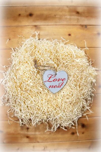 Beautiful love heart in a love nest — Stock Photo, Image