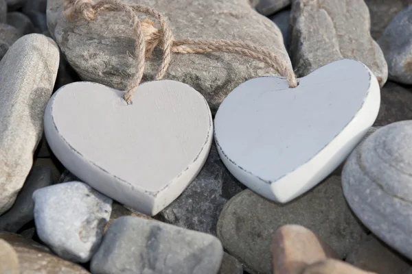 Two love hearts on a rocky beach — Stock Photo, Image