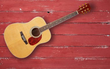 Müzik enstrümanı - Kırmızı ahşap arka planda üst görünüm akustik gitar